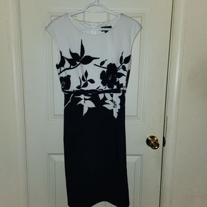 Connected Apparel Knee length navy blue and white floral dress with belt.